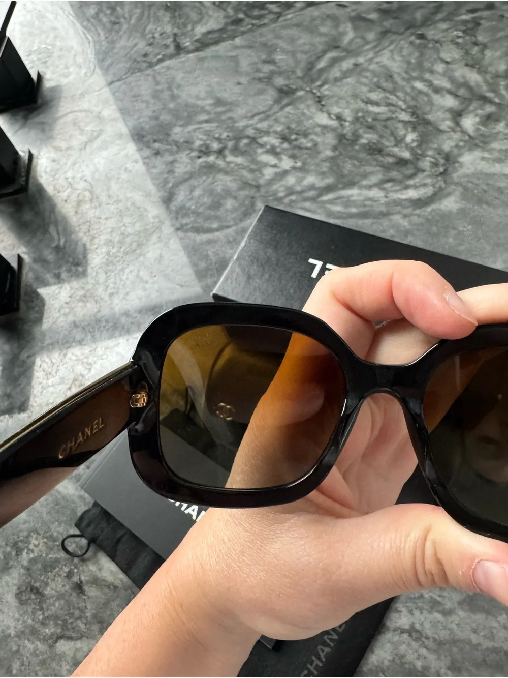 CHANEL Black Sunglasses with Gold Logo Accent